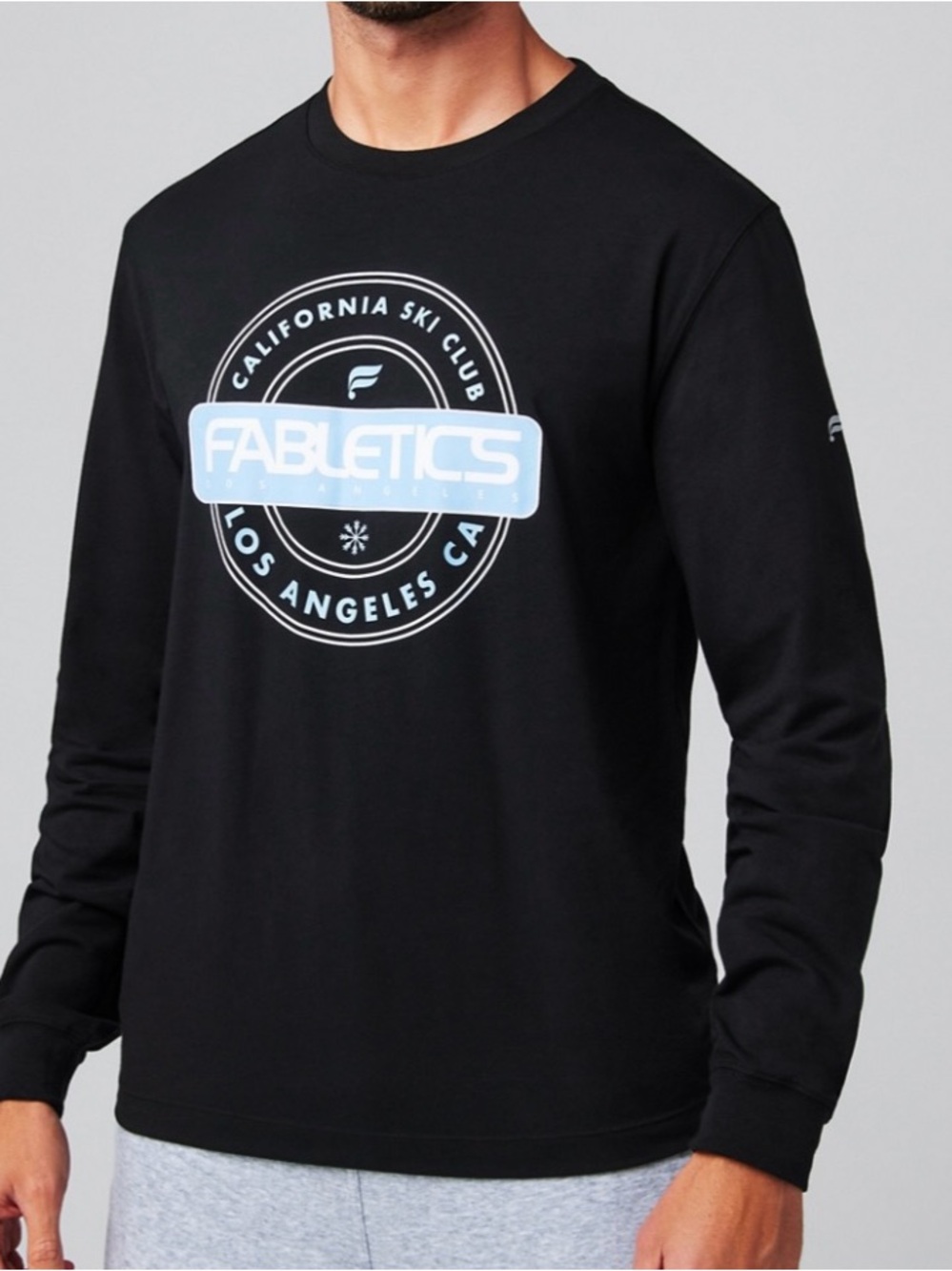 Fabletics Black Long-Sleeve Tee with Light Blue Logo Graphic